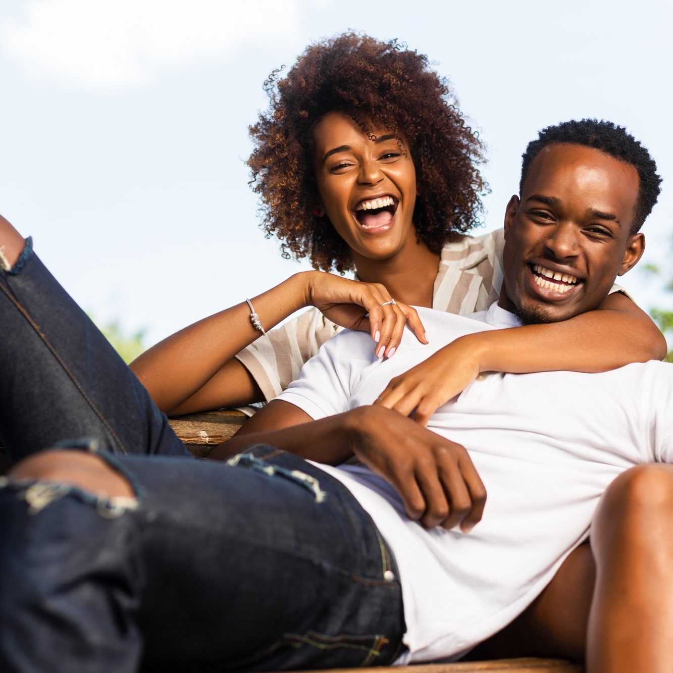 A couple sharing a relaxed moment outdoors